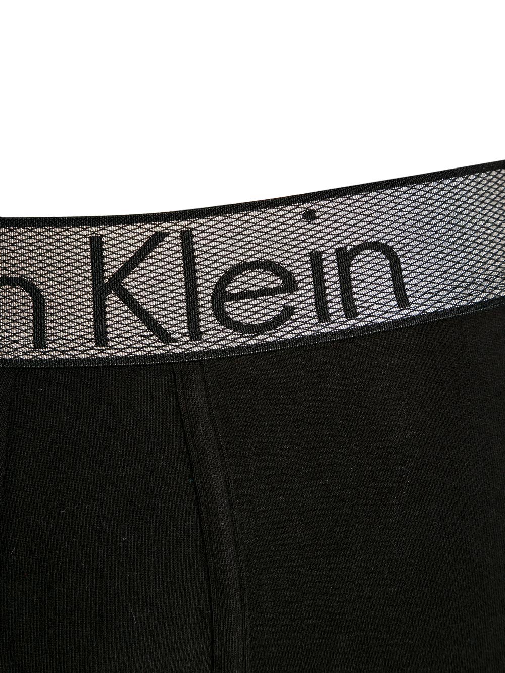 Slip Uomo Calvin Klein Nero con Elastico Argentato - NB1297A1 B Slip Uomo Calvin Klein Nero con Elastico Argentato - NB1297A1 B